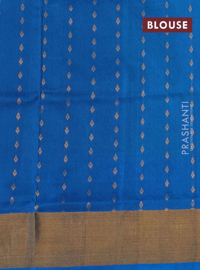 Pure uppada silk saree dual shade of green and cs blue with allover zari woven buttas and zari woven border
