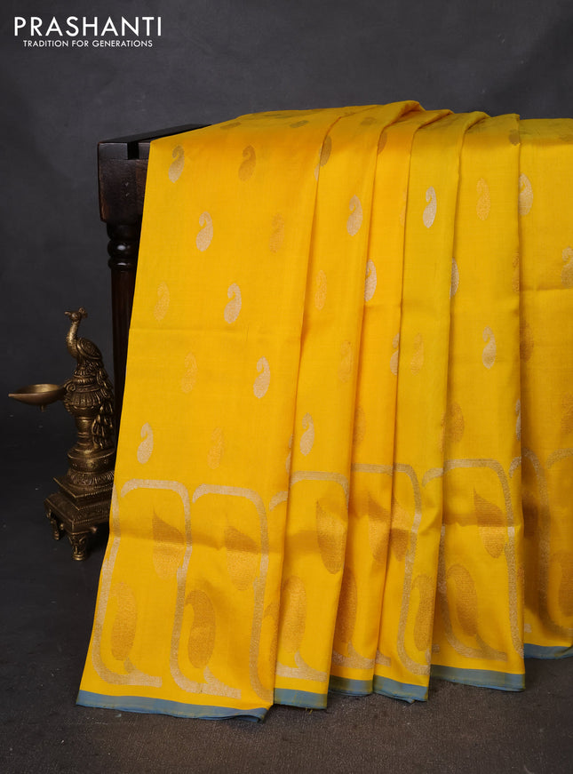 Pure uppada silk saree yellow and cs blue with silver & gold zari woven buttas and rich zari border