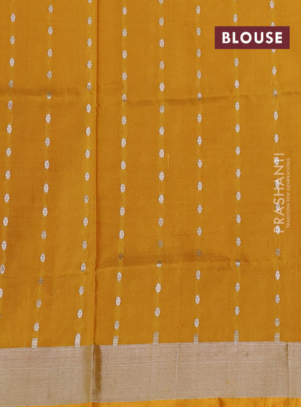 Pure uppada silk saree magenta pink and mustard yellow with allover silver zari woven butta weaves and silver zari woven border