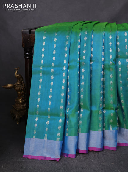 Pure uppada silk saree dual shade of teal green and pink with allover silver zari woven butta weaves and silver zari woven border