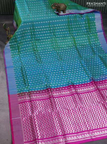 Pure uppada silk saree dual shade of teal green and pink with allover silver zari woven butta weaves and silver zari woven border