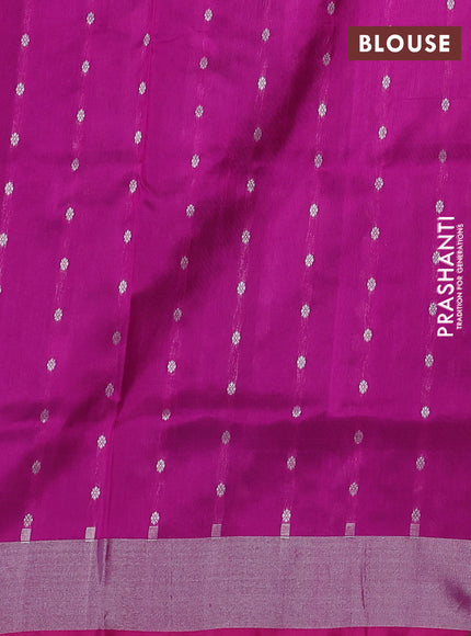 Pure uppada silk saree dual shade of teal green and pink with allover silver zari woven butta weaves and silver zari woven border