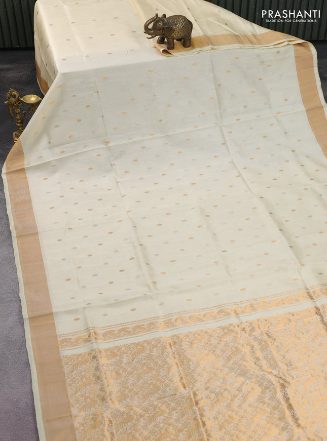 Pure uppada silk saree cream with silver & gold zari woven buttas and zari woven border