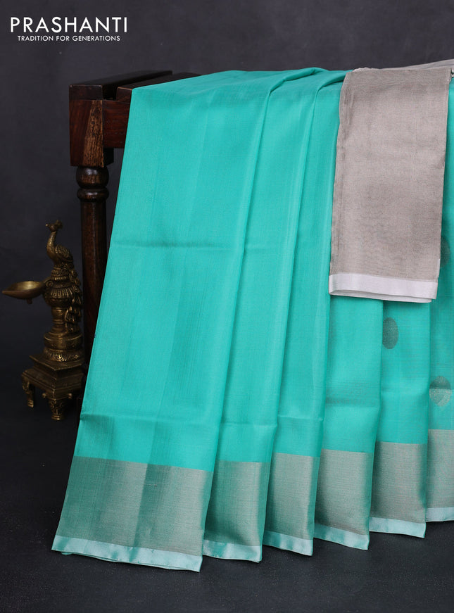 Pure uppada silk saree teal green shade with silver zari woven buttas and silver zari woven border