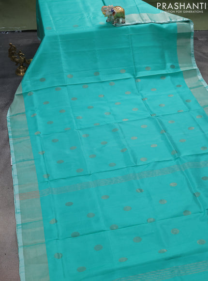 Pure uppada silk saree teal green shade with silver zari woven buttas and silver zari woven border