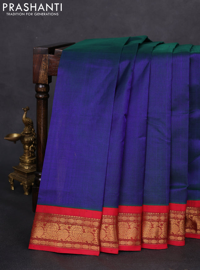 Silk cotton saree dual shade of bluish green and red with plain body and annam zari woven korvai border
