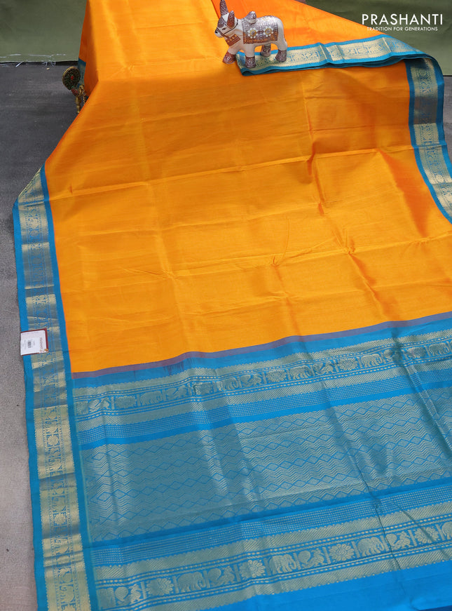 Silk cotton saree mango yellow and dual shade of teal blue with plain body and zari woven korvai border