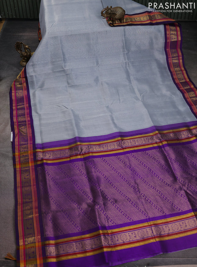 Silk cotton saree grey and violet with plain body and zari woven korvai border