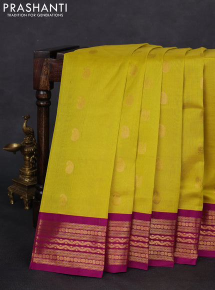 Silk cotton saree lime yellow and purple with paisley & annam zari woven buttas and zari woven korvai border