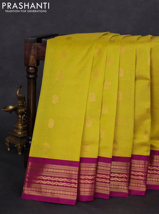 Silk cotton saree lime yellow and purple with paisley & annam zari woven buttas and zari woven korvai border