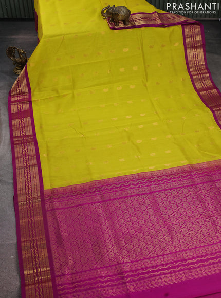 Silk cotton saree lime yellow and purple with paisley & annam zari woven buttas and zari woven korvai border