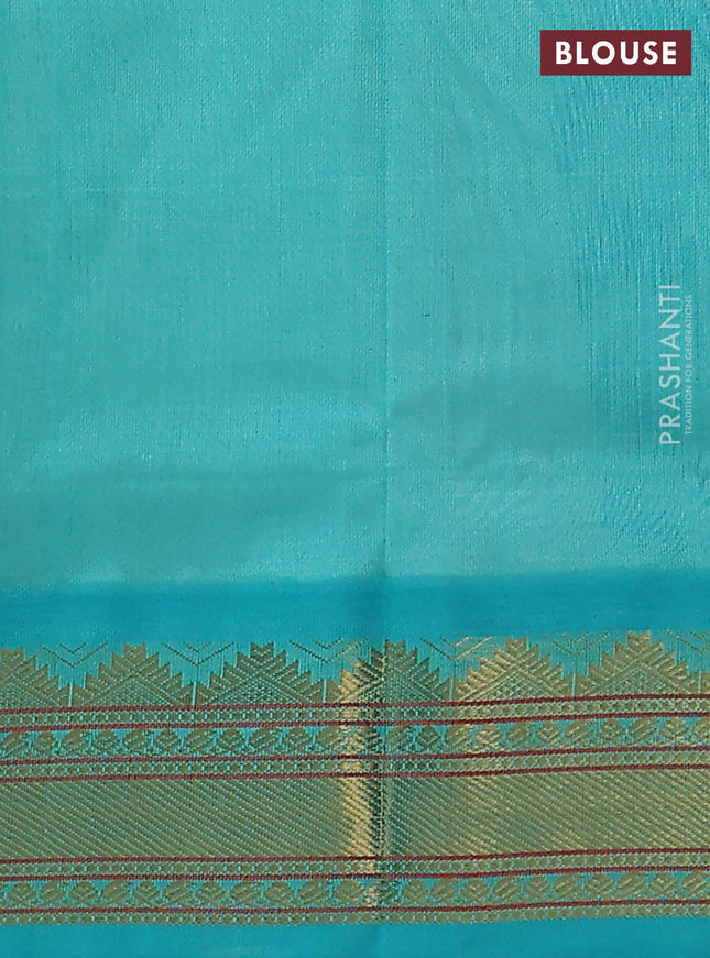 Silk cotton saree cream and teal blue with plain body and zari woven korvai border