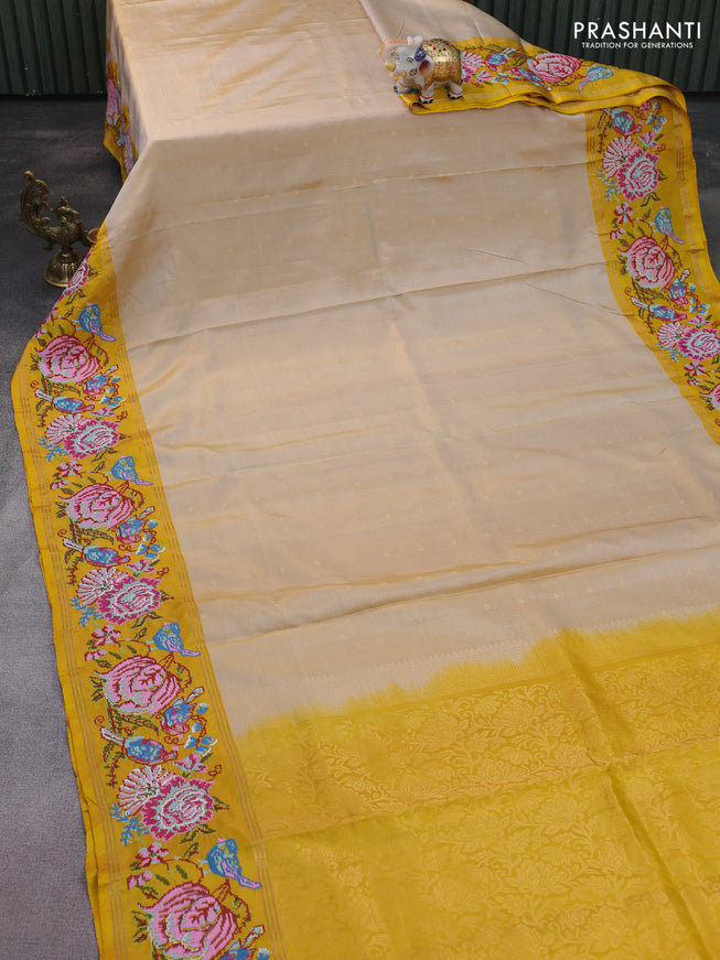 Pure soft silk saree beige and yellow with zari woven buttas and embroidery border