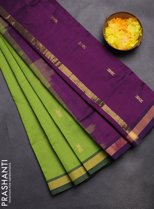 Semi silk cotton saree deep purple and light green with zari woven buttas and zari woven border