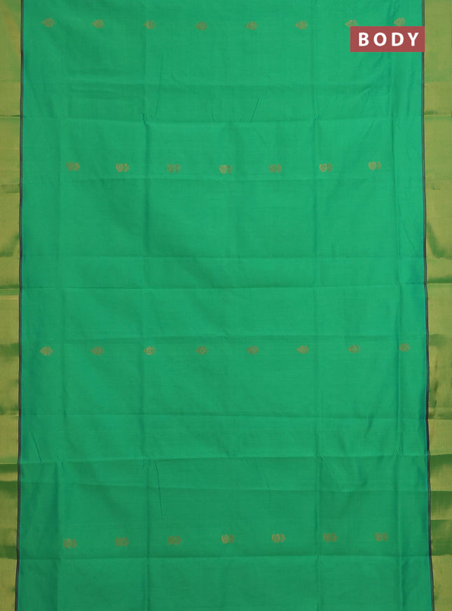Semi silk cotton saree green and purple with zari woven buttas and zari woven border