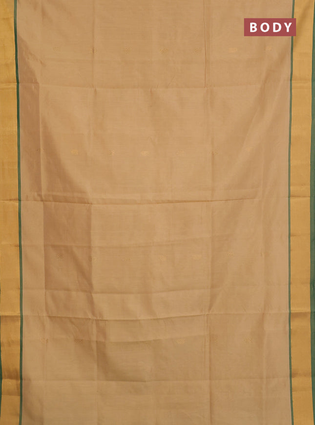 Semi silk cotton saree sandal and green with zari woven buttas and zari woven border