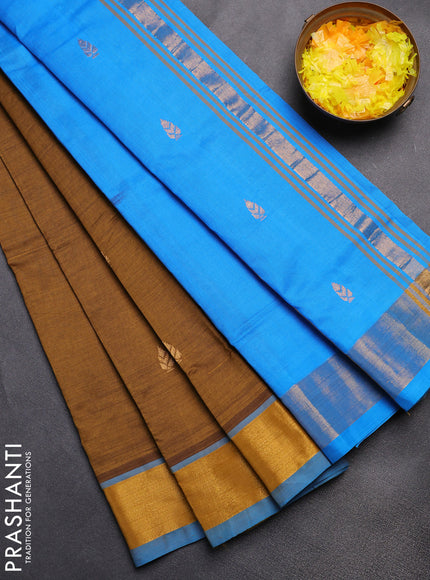 Semi silk cotton saree dark mehendi green and cs blue with zari woven buttas and zari woven border
