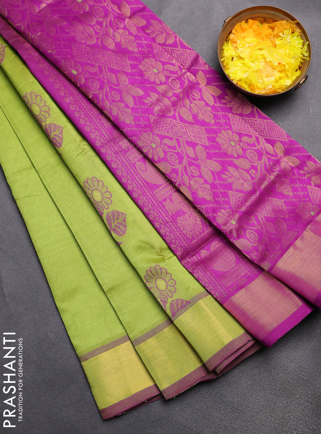 Semi silk cotton saree light green and purple with floral zari woven buttas and zari woven border