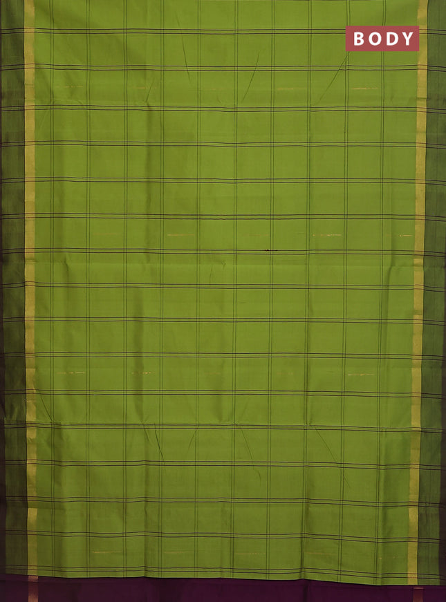 Semi silk cotton saree light green and wine shade with allover checks & zari buttas and zari woven simple border