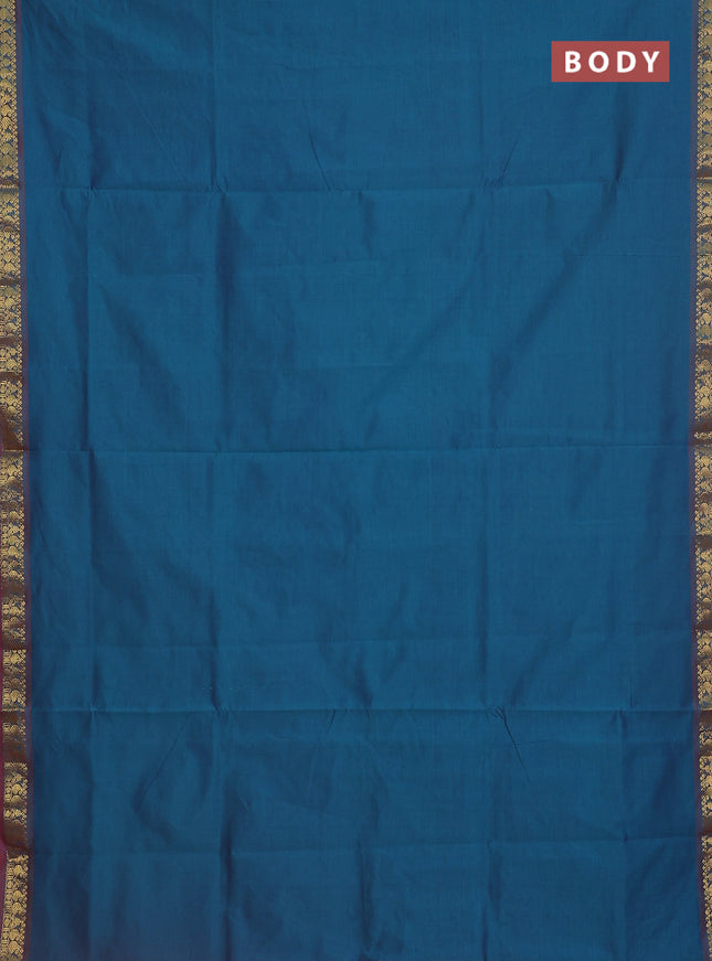 Semi silk cotton saree dual shade of peacock blue and red with plain body and zari woven border