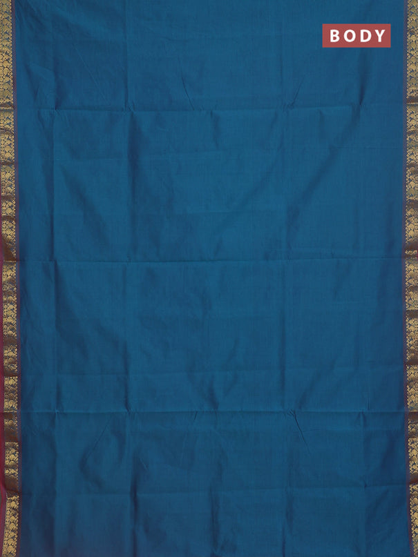 Semi silk cotton saree dual shade of peacock blue and red with plain body and zari woven border