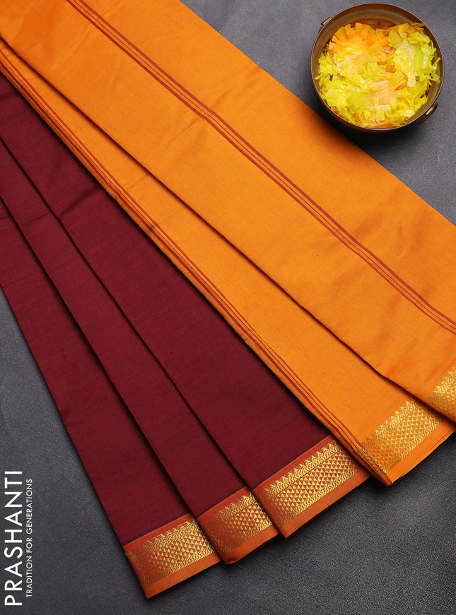 Semi silk cotton saree maroon and mango yellow with plain body and zari woven border