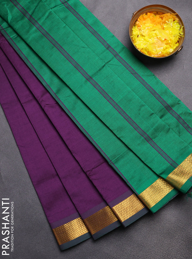 Semi silk cotton saree purple and green with plain body and zari woven border
