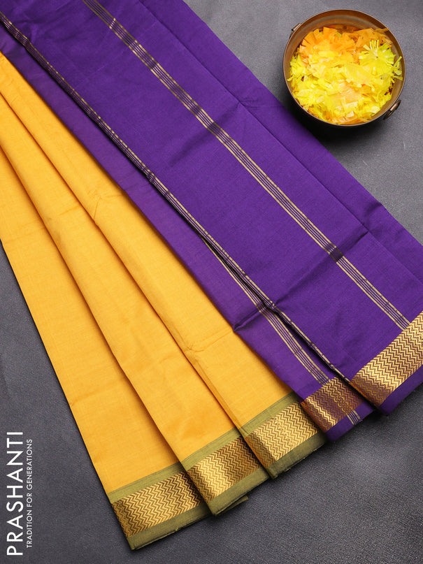 Semi silk cotton saree yellow and violet with plain body and zari woven border