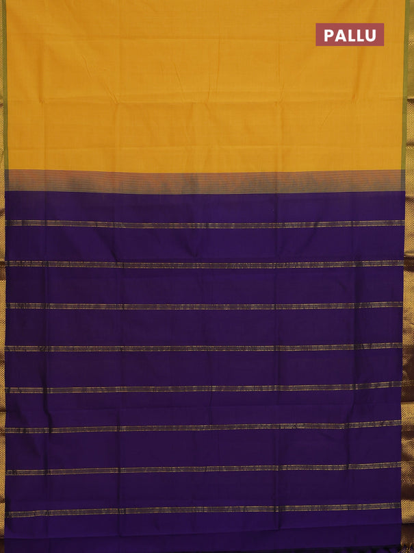 Semi silk cotton saree yellow and violet with plain body and zari woven border