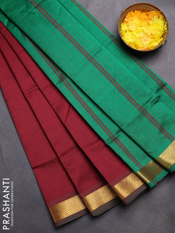 Semi silk cotton saree maroon and green with plain body and zari woven border
