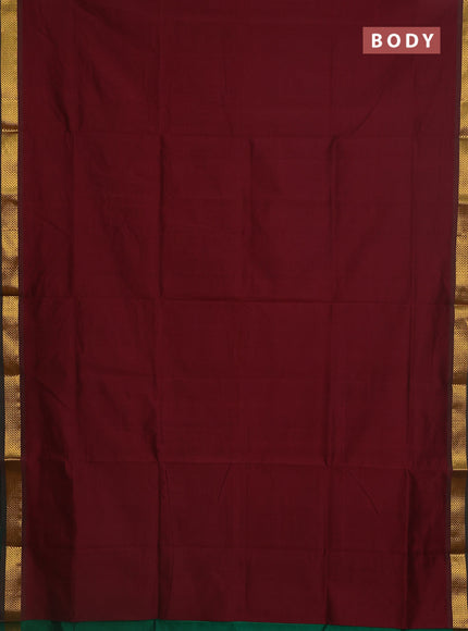 Semi silk cotton saree maroon and green with plain body and zari woven border