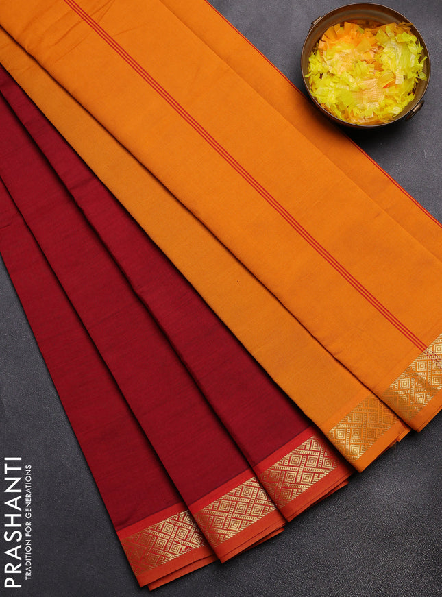 Semi silk cotton saree maroon and mustard yellow with plain body and zari woven border