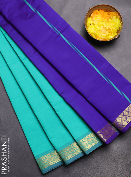 Semi silk cotton saree teal green and violet with plain body and zari woven border
