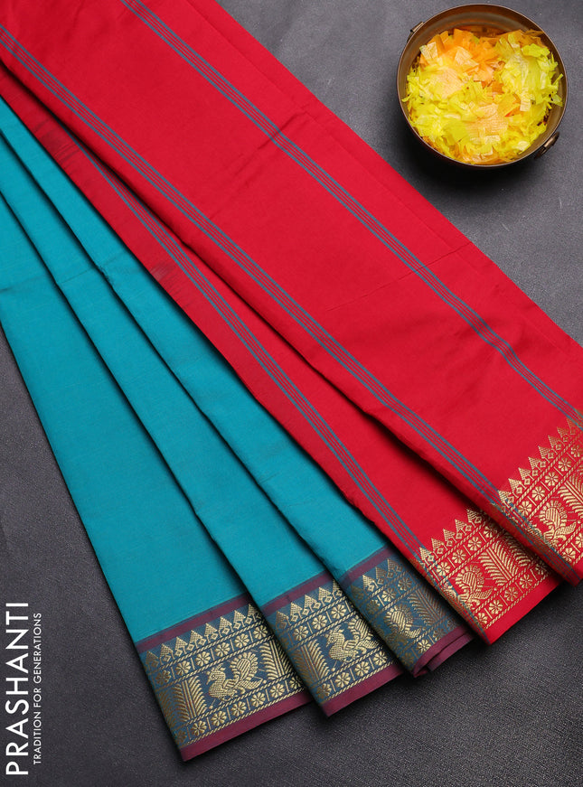 Semi silk cotton saree teal blue and red with plain body and zari woven border