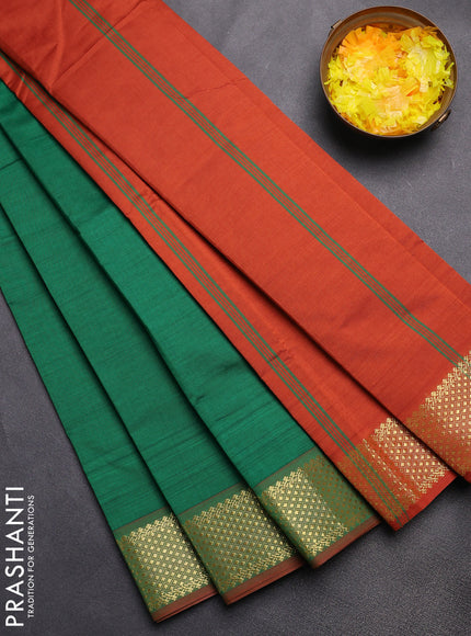 Semi silk cotton saree green and rust shade with plain body and zari woven border