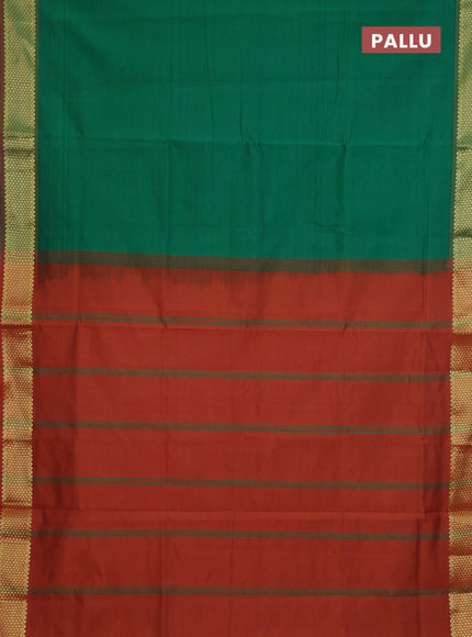 Semi silk cotton saree green and rust shade with plain body and zari woven border