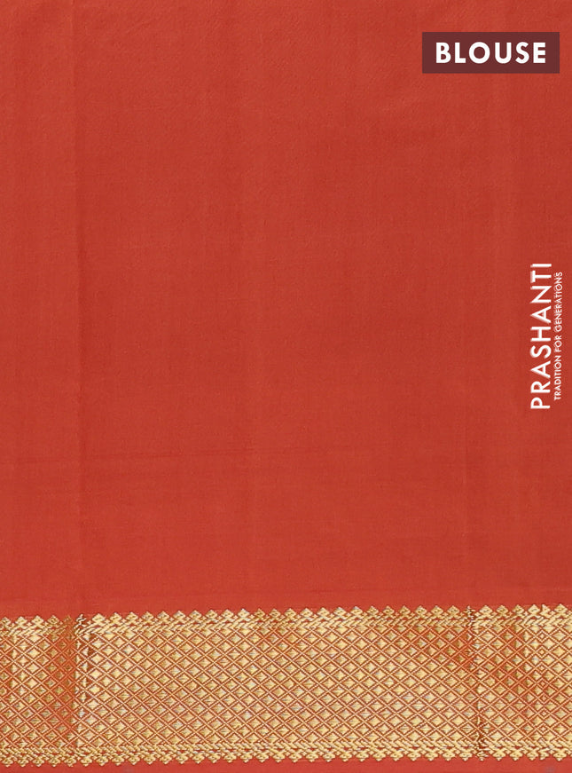 Semi silk cotton saree green and rust shade with plain body and zari woven border