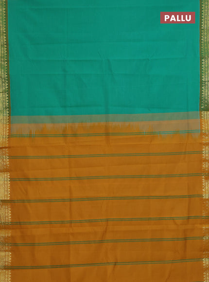 Semi silk cotton saree green and dark mustard with plain body and zari woven border