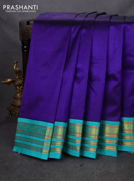 Silk cotton saree blue and teal green with plain body and zari woven korvai border