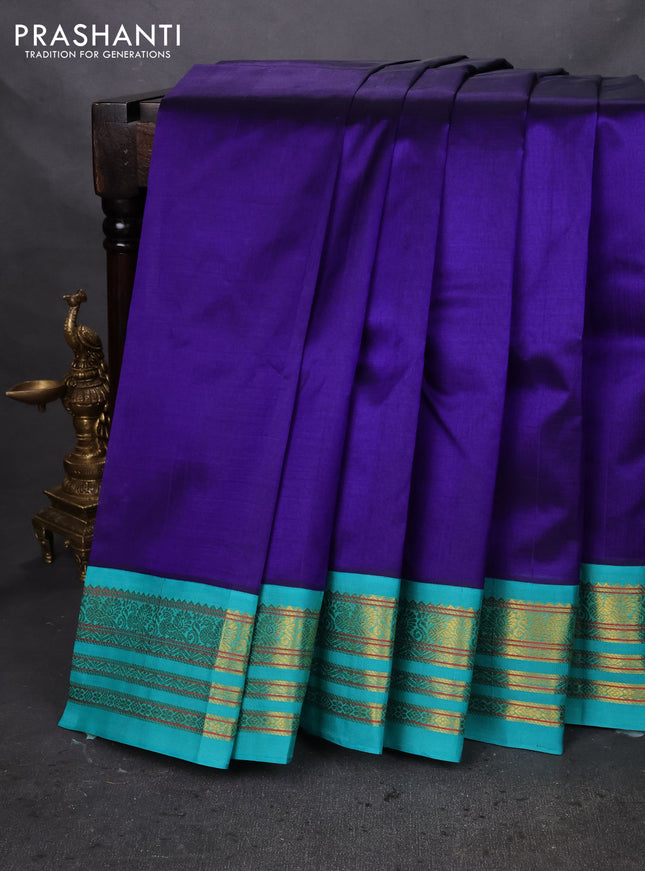Silk cotton saree blue and teal green with plain body and zari woven korvai border