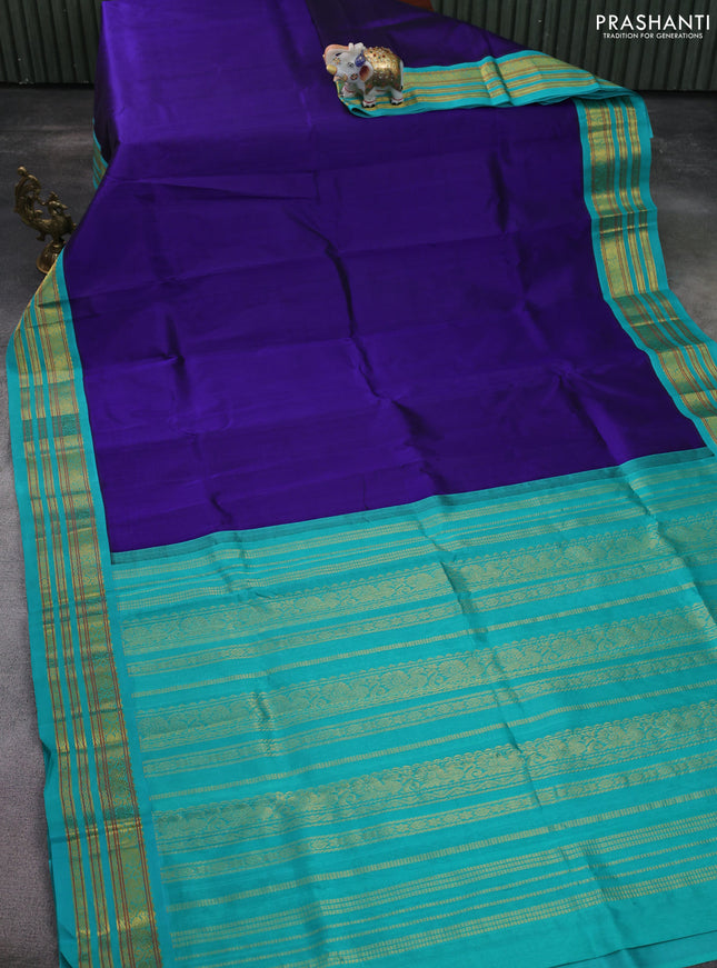 Silk cotton saree blue and teal green with plain body and zari woven korvai border