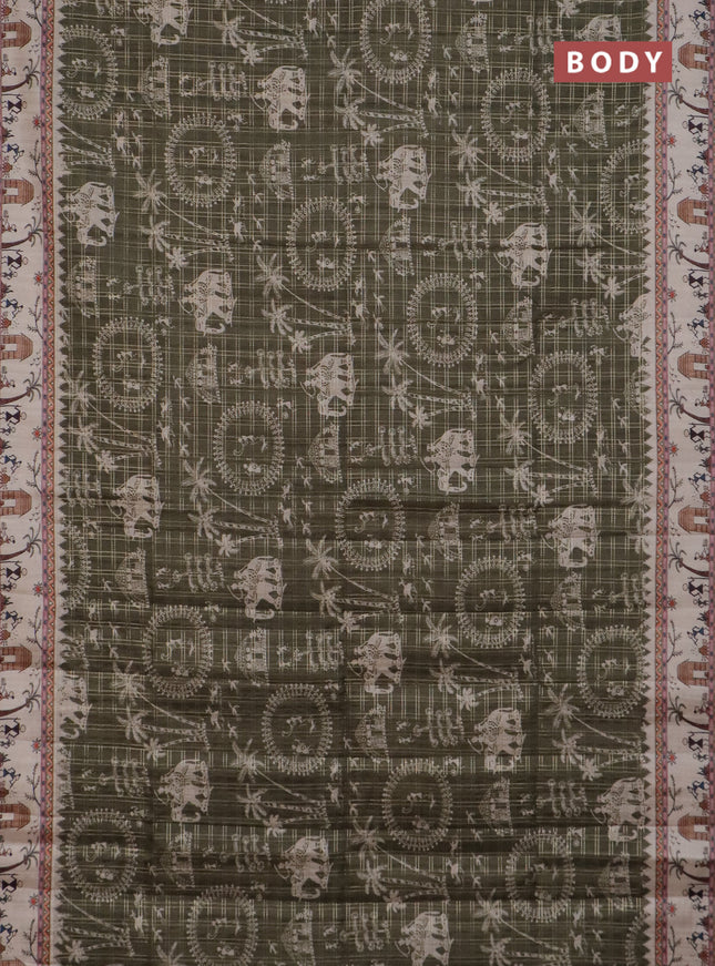 Semi tussar saree sap green and cream with allover zari checks & warli prints  and printed border