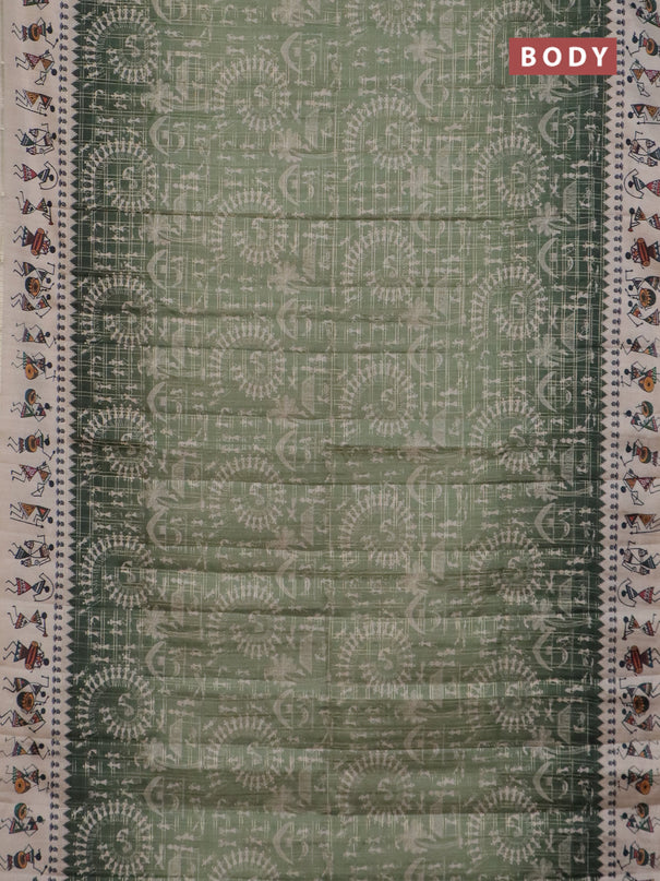 Semi tussar saree pastel green and cream with allover zari checks & warli prints  and printed border