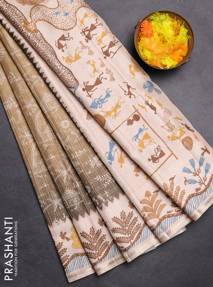 Semi tussar saree mehendi green and cream with allover zari checks & warli prints  and printed border