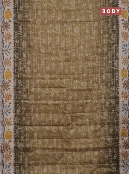 Semi tussar saree mehendi green and cream with allover zari checks & warli prints  and printed border