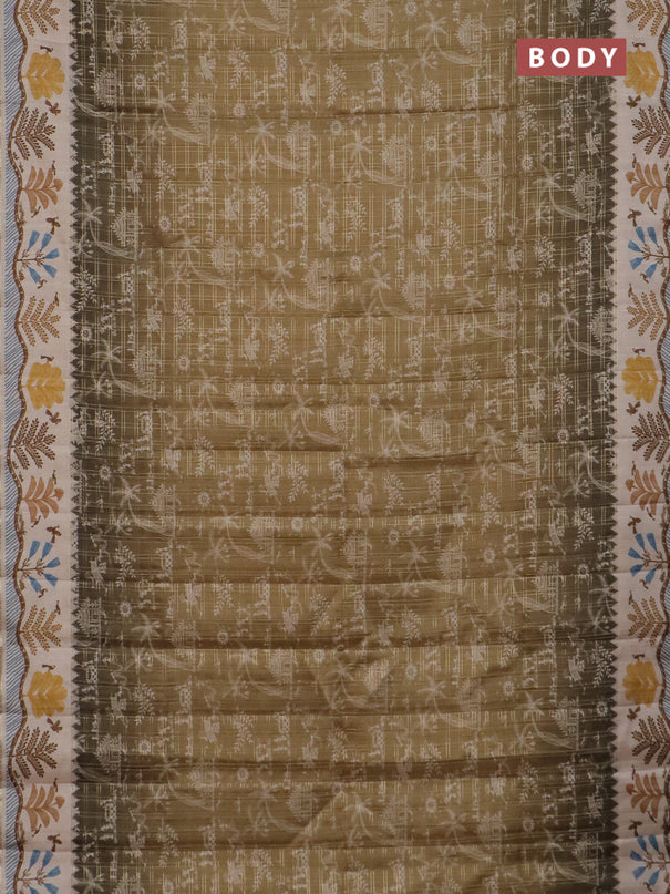 Semi tussar saree mehendi green and cream with allover zari checks & warli prints  and printed border