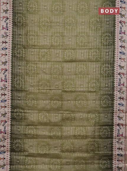 Semi tussar saree sap green and cream with allover zari checks & warli prints  and printed border