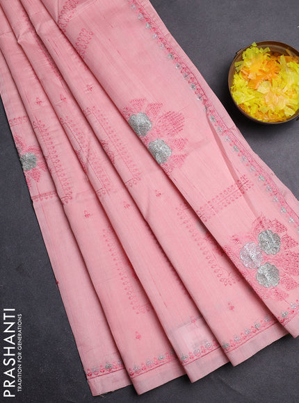 Semi raw silk saree mild peach with allover embroidery buttas and embroidery border