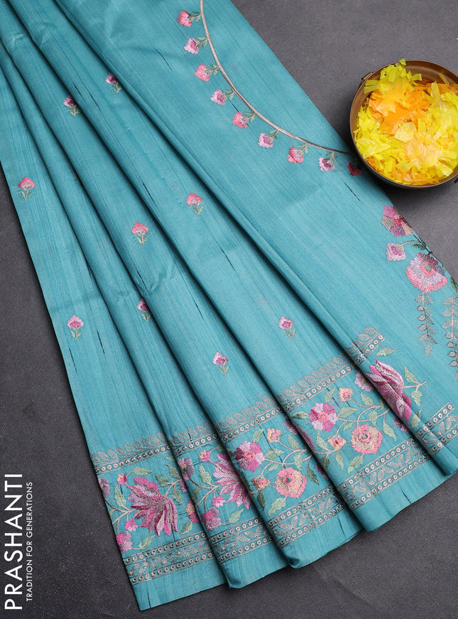 Semi raw silk saree teal blue with embroidery buttas and floral embroidery border