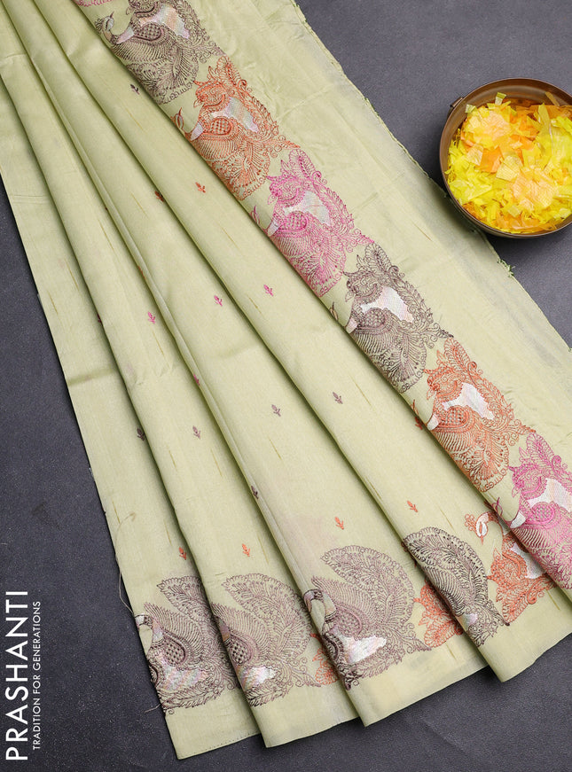 Semi raw silk saree mild pista green with allover embroidery work and peacock embroidery border